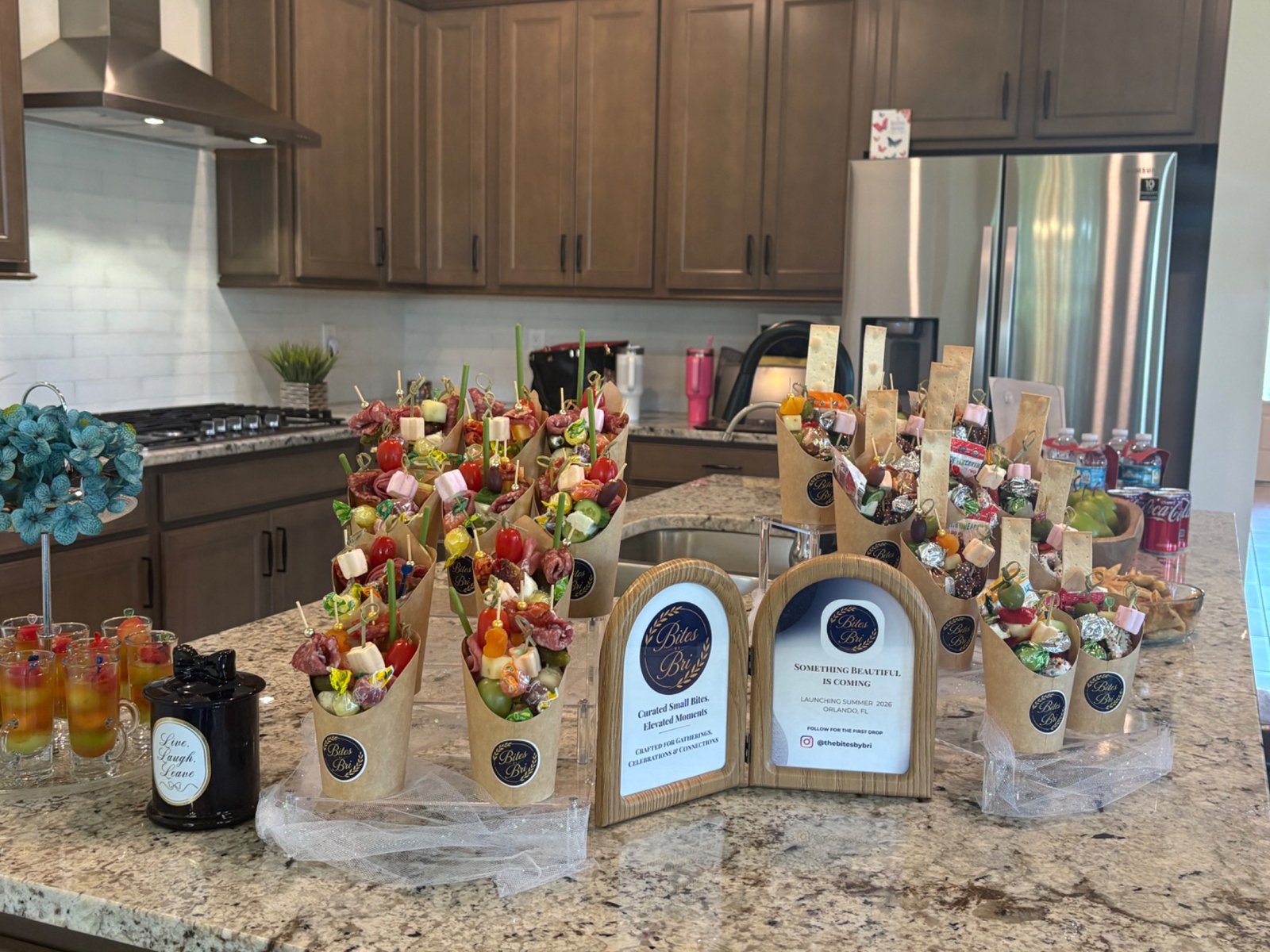 Bites by Bri individual cups displayed for guests at a real estate open house